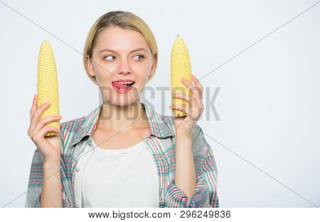 Raw Or Cooked. Agriculture And Cultivation. Corn Crop. Vitamin And Dieting Food. Happy Woman Eating 