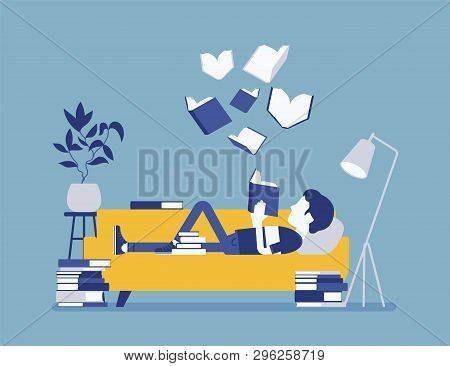 Male Book Reader. Boy Reads For Pleasure Lying On Sofa, Enjoys Free Time Around Literary Pages, Open
