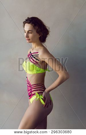 Girl Made Kinesiotape Belly And Chest Standing In The Studio