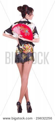Beautiful young woman in Asian costume with red Asian fan