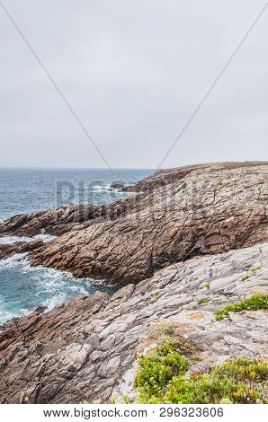 Beach And Cliff In Quiberon In The Morbihan In France, On The Peninsula Of Quiberon