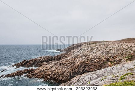 Beach And Cliff In Quiberon In The Morbihan In France, On The Peninsula Of Quiberon