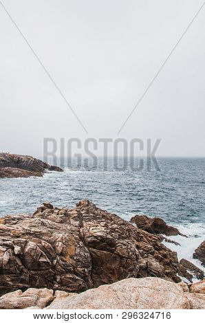 Beach And Cliff In Quiberon In The Morbihan In France, On The Peninsula Of Quiberon