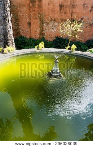 Fountain In A Garden Of The Real Alcázar Palace In Seville, Spain