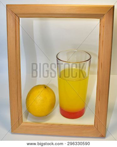 Decoration Of Light Bulbs And Cap Hanging On A Wire In A Frame Of Wood On A White Background