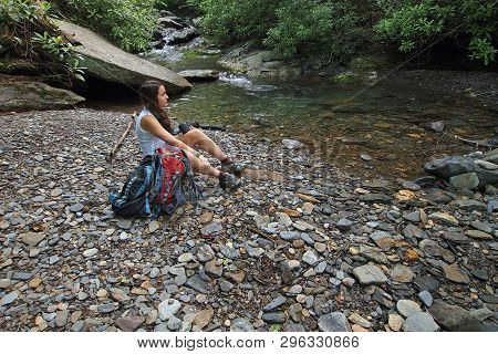 A Young Woman Sitting By A Trailside Stream In The Great Smoky Mountains National Park, Tennessee, I
