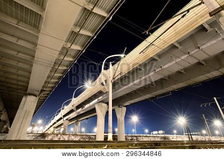 Highway/expressway With Concrete Pillars  In St. Petersburg At Night, Bottom View. Parallel Roads.ov