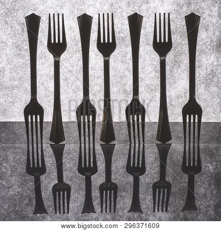 Very Simple Still Life With Forks On Gray Background