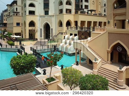 Dubai, UAE - April 12, 2019: View of Souk al Bahar and the turquoise Burj Khalifa Lake