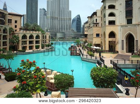 Dubai, UAE - April 12, 2019: View of Souk al Bahar and the turquoise Burj Khalifa Lake