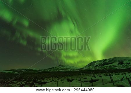 Northern Light Aurora Borealis In Clear Sky Night In Iceland.natural Landscape Of Light Phenomenon I
