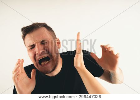 Crop Person Slapping Scared Man In Face
Emotional Male Getting Slapped In Face While Shouting With C