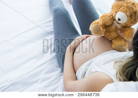 Portrait Of Beautiful Young Pregnant Woman With A Headache And Pain.pregnancy Health Care Preparing 