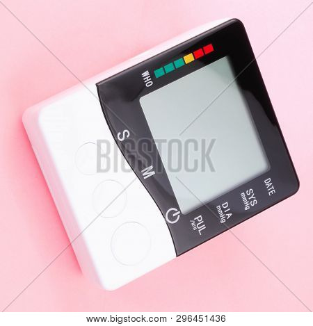 Blood Pressure Monitor On Pink Background At Dry Sunny Summer Day
