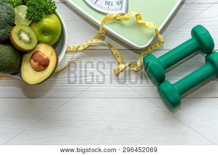 Diet And Healthy Life Loss Weight Concept. Green Apple And Weight Scale Measure Tap With Fresh Veget