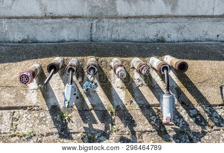Old Damaged Electric Plug Power Line Installations On The River Shore Or Ocean Marine For Yachts  Bo