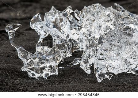 Amazing Transparent Blue Iceberg Pieces On Diamond Beach With Black Sand Near Jokulsarlon Lagoon, Ic