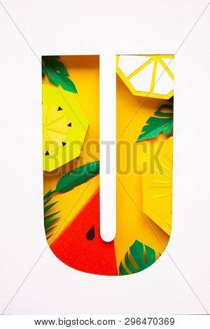 Letter U Cut From Paper With Tropical Fruit Paper