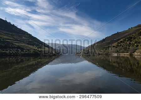 View Of Douro River With Terraced Vineyards Near The Village Of Pinhao, In Portugal; Concept For Tra