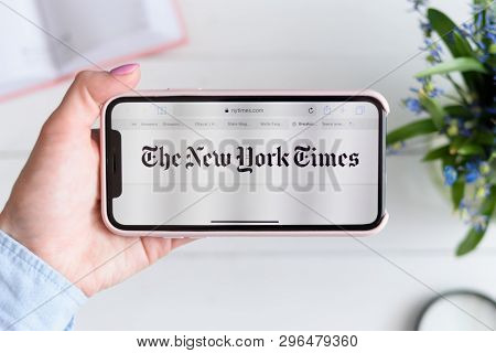 Kharkiv, Ukraine - April 10, 2019: Apple Iphone X In Female Hand With Nytimes.com Site On The Screen