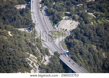 Menton, France - April 19, 2019: Aerial View Of Cars Traffic Moving On A Highway Bridge With Exit In