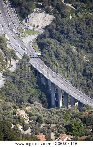 Menton, France - April 19, 2019: Aerial View Of Cars Traffic On A Highway Bridge With Pillars And Fr