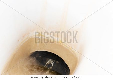 Dirty Unhygienic Toilet Bowl With Limescale Stain At Public Restroom Close Up