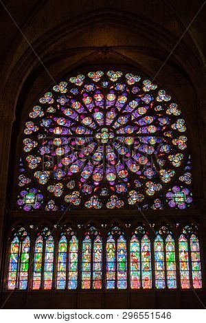 PARIS, FRANCE, SEPTEMBER 1, 2018 : Ancient stained window rosace in the Notre Dame de Paris cathedral