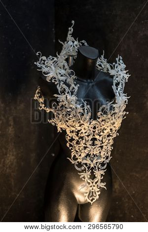 Piece made with 3d printer, is composed of white flowers that form a corset, handmade, fantasy design Baroque style
