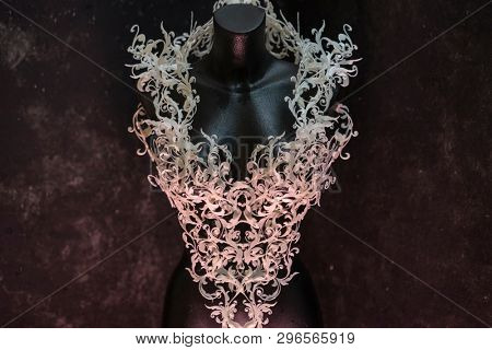 Piece made with 3d printer, is composed of white flowers that form a corset, handmade, fantasy design Baroque style