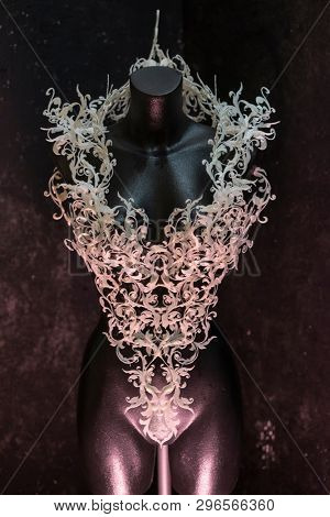 Piece made with 3d printer, is composed of white flowers that form a corset, handmade, fantasy design Baroque style