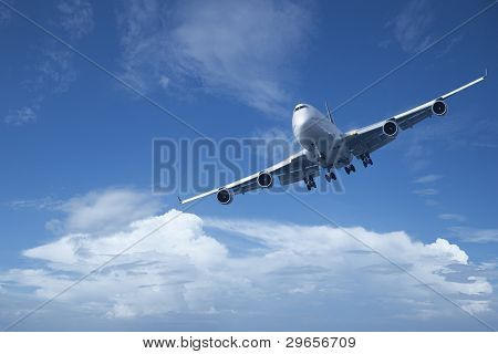 Jet Is Maneuvering In A Blue Cloudy Sky