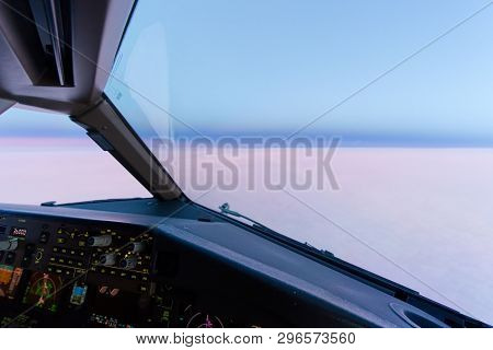 Beautiful Twilight Sunset Sky At High Altitude From Airplane Cockpit View. Inside Cockpit Can See Fl