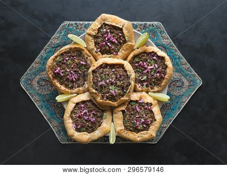 Open Meat Pies On A Black Background. Top View