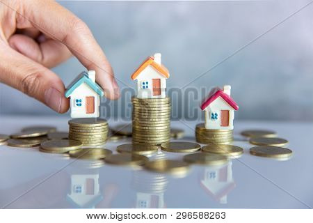 Mini House On The Table, Money And House,  Mortgage, Savings Money For Buy House And Loan To Busines