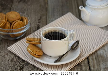 Cup Of Coffee With Sweet Cookies, Ginger Bread. Abstract Breakfast Image. Rustick Wooden Background.