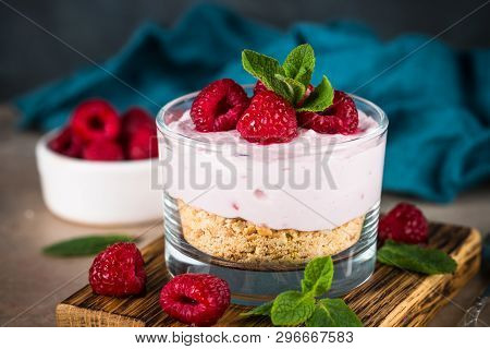 No Baked Cheesecake With Raspberry In Glass Jar. Healthy Dessert.