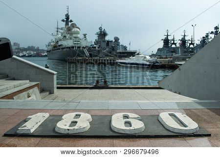 The Bow Of The Warships In The Bay Anchored Astern To The Pier