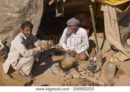 Nagaur, Rajasthan, India - February 13, 2008: Men Preparing A Meal Outside Their Makeshift Tent Duri