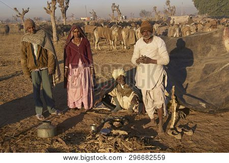 Nagaur, Rajasthan, India - February 14, 2008: Preparing Food And Arming Up After A Cold Night Campin