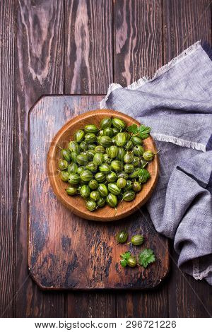 Sweet Fresh Gooseberry Berry In A Bowl On Dark Background. Top View