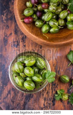 Sweet Fresh Gooseberry Berry In A Bowl On Dark Background. Top View