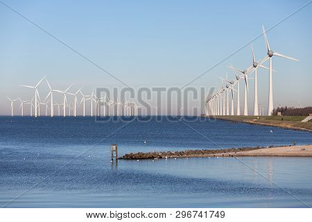 View At Off Shore Wind Turbine Farm From Beach Former Island Urk, The Netherlands