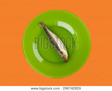 Cold Smoked Baltic Herring On An Green Plate On Orange Background. Smoked Baltic Herring Smoked Unti