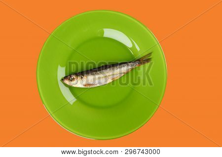 Cold Smoked Baltic Herring On An Green Plate Isolated On Orange Background. Smoked Baltic Herring Sm