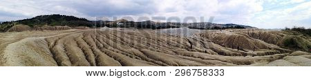 Panoramic View Of An Arid Landscape Created By The Mud Volcanoes In Berca, Romania. A Mud Volcano Or