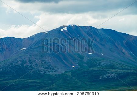 Amazing Giant Mountain With Snow On Top In Mist In Overcast Weather. Huge Snowy Mountain In Haze Und