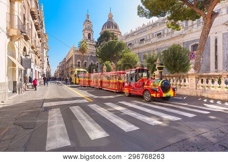 Tourist Train Near Cathedral Of Santa Agatha On Sunny Morning, Sicily,
