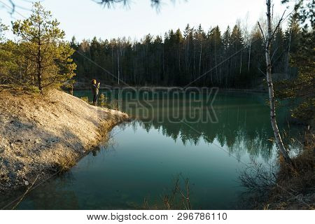 Young Woman Takes Travel Photos -beautiful Turquoise Lake In Latvia - Meditirenian Style Colors In B