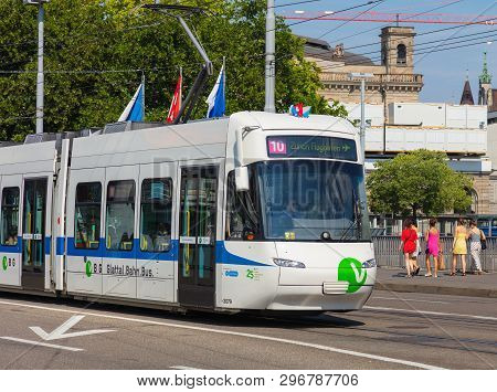 Zurich, Switzerland - August 1, 2018: A Tram Of The Vbg Company Heading To The Zurich Airport Passin